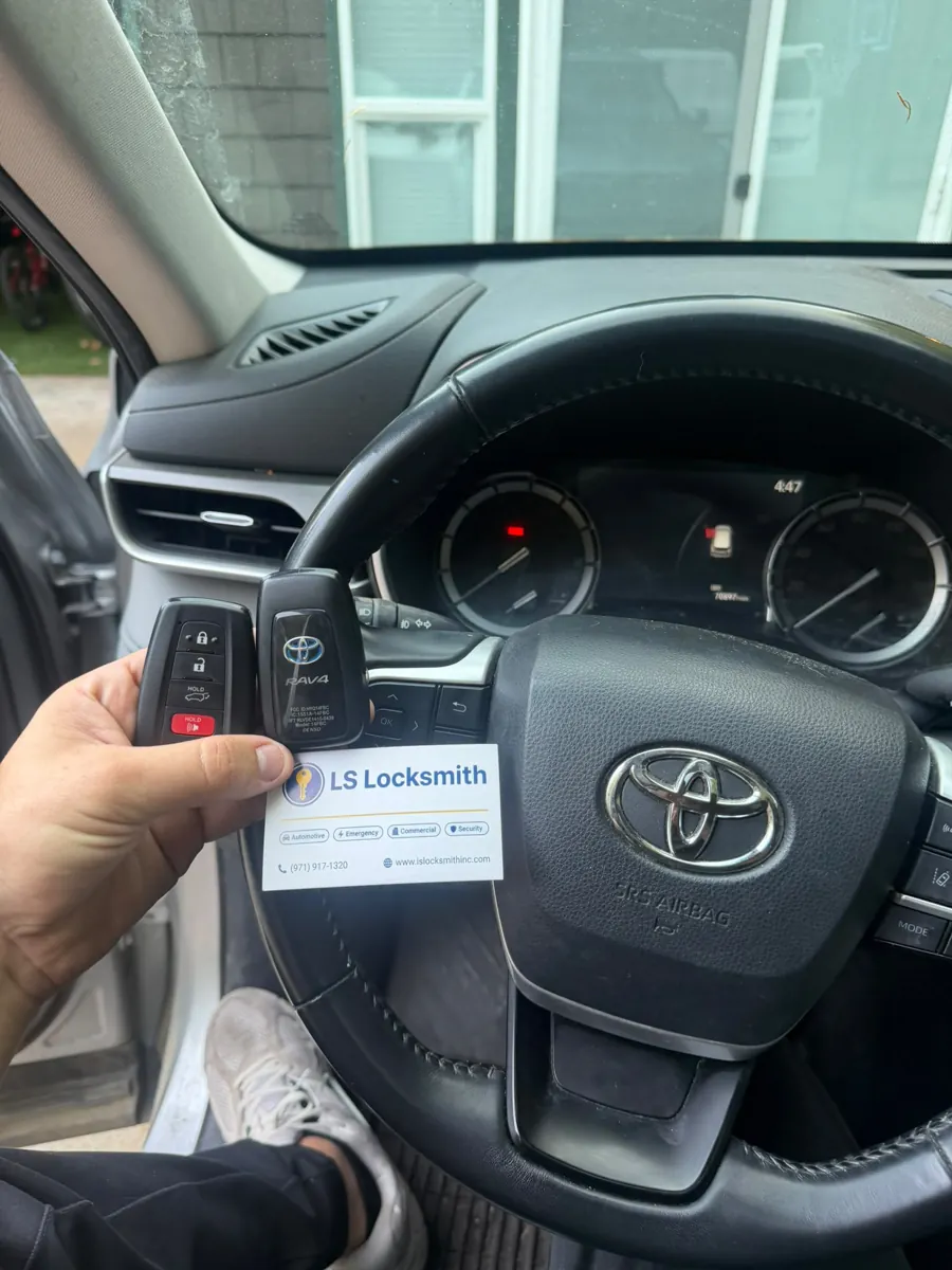 Toyota steering wheel, key fob, and LS Locksmith business card